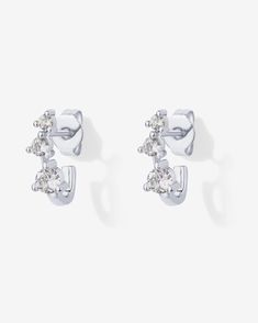 Upgrade your style with our elegant half-huggie earrings. Measuring 12mm in length and 1.8mm in width, these earrings feature premium AAAAA cubic zirconia in varying sizes. They seamlessly complement any style, adding a touch of sophistication to your wardrobe.Materials: 18K Yellow Gold or Rhodium plated Premium AAAAA cubic zirconia stones Measurements: Length: 12mm Width: 1.8mm. Stone sizes: 3mm, 2.5mm, and 2mm Hypoallergenic; nickel, cadmium, and lead free. Huggie Earrings, Recycled Metal, Upgrade Your Style, Everyday Jewelry, Huggies Earrings, Jewelry Organization, Quality Jewelry, Amazing Jewelry, Rhodium Plated