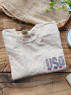 Simple, minimalistic patriotic pocket tee for summer.  Great to wear anytime! Pocket is not functional due to the stitching.  This design looks great on a denim blue, red, white or ivory tshirt. If you prefer a regular tee with no pocket, please enter that in the personalization section. - Comfort Colors Unisex sizing - Embroidered design Please message me with any questions! Cancellations will not be refunded if your shirt has been ordered. I do not keep stock on hand.  No returns or exchanges. Red Ribbon Week, Usa Shirt, Patriotic Shirts, Comfort Colors Tee, Flag Tshirt, Pocket Tee, Embroidered Shirt, Embroidered Design, Red Ribbon