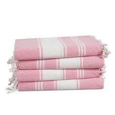 three pink and white towels stacked on top of each other