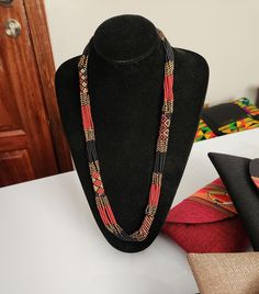 Brown African beaded necklace , Zulu necklace , Multistrand necklace , Colorful necklace. This necklace is 100% handcrafted using colorful fine beads. The necklace makes a perfect gift to loved ones. Dimensions; 32 inches. **Buy multiple items and pay shipping for 1 item only.The rest ships free. Custom orders are welcome. More neckleces here; https://www.etsy.com/shop/TribalTess?ref=seller-platform-mcnav§ion_id=21306083 Back to my shop; https://www.etsy.com/shop/TribalTess?ref=seller-platform-m Traditional Brown Hand-strung Beaded Necklaces, Traditional Brown Multi-strand Necklaces, African Beads Necklace, Artisan Multi-strand Red Necklaces, Zulu, African Beads, Colourful Necklace, Multi Strand Necklace, Multi Strand