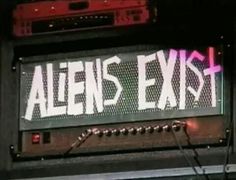 a sign that says alien's exist on it