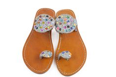 Moroccan bridal sandals, we bet to make it the best to compliment your outfit. Be the star woman by wearing this pair of beautiful leather Beaded sandals which hold the manufacturing perfection of Ethnic Arts. These summer sandals have multicolor striped embroidery work. The brown insole makes these women's flip flop slippers even unique to wear. These Wedding sandals look best when teamed with your daily outfits. Made from high quality material, these are comfortable and durable. You can carry Leather Sandals With Rhinestones And Single Toe Strap, Leather Sandals With Rhinestones And Flat Heel, Leather Flat Heel Sandals With Rhinestones, Open Toe Rhinestone Festival Sandals, Rhinestones Open Toe Festival Sandals, Festival Rhinestone Open Toe Sandals, Bedazzled Round Toe Sandals For Beach, Bedazzled Round Toe Beach Sandals, Bedazzled Flat Sandals For Summer