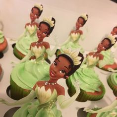 the cupcakes are decorated like princesses and have green frosting on them