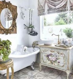 a white bath tub sitting next to a sink in a bathroom under a window with curtains