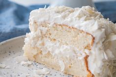 a slice of coconut cake on a plate