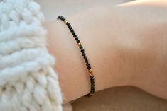 Tiny black spinel beaded gemstone bracelet with hematite gold | Etsy Simple Black Bracelet, Baby Black Beads Bracelet, Nazariya Bracelet For Baby, Hand Mangalsutra Bracelet In Gold, Mangalsutra Bracelet Design, Black Beads Bracelet Gold, Hand Mangalsutra Bracelet, Nazariya Bracelet, Bracelet With Black Beads