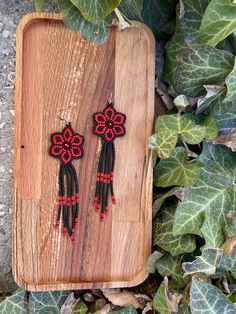 Matte Red Black Floral Earring, Huichol Earrings, Beaded Earrings, Dangling Flower Earrings, Cute Burgunfy Flower Earrings, Seed Bead Earrings ♥𝑇ℎ𝑒 𝑝𝑎𝑡𝑡𝑒𝑟𝑛 𝑜𝑓 𝑡ℎ𝑖𝑠 𝑒𝑎𝑟𝑟𝑖𝑛𝑔 𝑖𝑠 𝑐𝑟𝑒𝑎𝑡𝑒𝑑 𝑏𝑦 𝐾𝑎𝑍𝑒𝐵𝑒𝑎𝑑𝐽𝑒𝑤𝑒𝑙𝑟𝑦 ♥𝑀𝑎𝑑𝑒 𝑢𝑠𝑖𝑛𝑔 𝑓𝑟𝑒𝑒ℎ𝑎𝑛𝑑 𝑏𝑒𝑎𝑑𝑖𝑛𝑔 𝑤𝑜𝑣𝑒𝑛 𝑡𝑒𝑐ℎ𝑛𝑖𝑞𝑢𝑒𝑠 𝑤𝑖𝑡ℎ 𝑠𝑡𝑟𝑜𝑛𝑔 𝑠𝑦𝑛𝑡ℎ𝑒𝑡𝑖𝑐 𝑡ℎ𝑟𝑒𝑎𝑑. ♥𝑇ℎ𝑒 𝑠𝑖𝑧𝑒 𝑜𝑓 𝑡ℎ𝑒 𝑠𝑒𝑒𝑑 𝑏𝑒𝑎𝑑𝑠 𝑢𝑠𝑒𝑑 𝑖𝑠 2 𝑚𝑖𝑙𝑙𝑖𝑚𝑒𝑡𝑒𝑟𝑠 𝑎𝑛𝑑 𝑏𝑒𝑎𝑑𝑠 𝑎𝑟𝑒 ℎ𝑖𝑔ℎ 𝑞𝑢𝑎𝑙𝑖𝑓𝑖𝑒𝑑. ♥𝐴𝑙𝑙 𝑡ℎ𝑒 ℎ𝑜𝑜𝑘𝑠 𝑢𝑠𝑒𝑑 𝑖𝑛 𝑜𝑢𝑟 𝑗𝑒𝑤𝑒𝑙𝑟𝑦 𝑎𝑟𝑒 24 𝑘 𝑔𝑜𝑙𝑑 𝑝𝑙𝑎𝑡𝑒𝑑 𝑎𝑛𝑑 ℎ𝑦𝑝𝑜𝑎𝑙𝑙𝑒𝑟𝑔𝑒𝑛𝑖𝑐. ♥𝑇ℎ𝑒𝑠𝑒 𝑎𝑟𝑒 𝑣𝑒𝑟𝑦 𝑙𝑖𝑔ℎ𝑡 𝑒𝑎𝑟𝑟𝑖𝑛𝑔𝑠 𝑡ℎ𝑎𝑡 𝑦𝑜𝑢 𝑐𝑎𝑛 𝑤𝑒𝑎𝑟 𝑎𝑙𝑙 𝑑𝑎𝑦 𝑤𝑖𝑡ℎ𝑜𝑢𝑡 ℎ𝑢𝑟𝑡𝑖𝑛𝑔 𝑦𝑜𝑢𝑟 𝑒𝑎𝑟! The Adjustable Red Flower Beaded Earrings, Red Flower Beaded Earrings With Dangling Beads, Red Beaded Dangle Flower Earrings, Traditional Red Earrings With Black Beads, Red Earrings With Black Beads As Gift, Red Earrings With Black Beads For Gift, Traditional Red Dangle Flower Earrings, Red Drop Earrings With Black Beads, Bohemian Black Flower Earrings For Gift