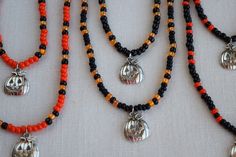 These fun and unique necklace and bracelet sets make a great addition to any Halloween costume. They are very nice and well made so you can wear them out or to the office to show that you are in the Halloween spirit and they will last for years. These jewelry sets also make a wonderful gift or party favor for your Halloween guests. The necklaces and bracelets are made with stretchy beading cord so this allows some flexibility in fit. I can make them to your desired length and also add a chain ex Halloween Festival Jewelry With Black Beads, Halloween Festival Black Beaded Jewelry, Halloween Gift Beaded Necklaces With Round Beads, Halloween Gift Beaded Necklace With Round Beads, Halloween Festival Jewelry With Round Beads, Halloween Gift Jewelry With Round Beads, Halloween Gift Round Beads Necklace, Halloween Silver Jewelry With Round Beads, Handmade Beaded Necklaces For Halloween Gift