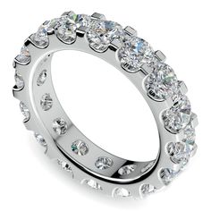 a wedding ring with lots of diamonds on it