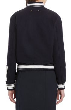 The Italian brand's logo is embroidered at the chest of a wool-blend varsity jacket that looks authentically retro down to the engraved snaps and striped rib. Front snap closure Blade collar Front welt pockets Ribbed cuffs and hem 72% virgin wool, 28% polyamide with 50% acrylic, 45% wool, 4% polyamide, 1% spandex trim Dry clean Made in Italy Women's Designer Clothing Golden Goose, Designer Outfits Woman, Welt Pockets, Logo Branding, Snap Closure, Varsity Jacket, Wool Blend, Designer Clothing, Dark Blue