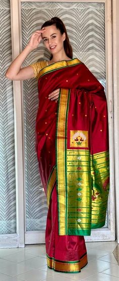 Early 2000s Pure Silk Red & Green Paithani Saree with Classic Peacock Motifs with Zari (Gold) and Pallu (End piece).  100% Silk. Handloom Fabric. Pre-Loved Geographical Origin: Maharashtra, India Semi-stitched Saree With Peacock Design, Festive Peacock Design Dupatta, Bollywood Style Festive Saree With Peacock Design, Bollywood Style Saree With Peacock Design For Festive Occasions, Bollywood Style Saree With Peacock Design In Traditional Drape, Bollywood Saree With Peacock Design For Festivals, Diwali Traditional Saree With Peacock Design, Festive Peacock Design Saree For Diwali, Diwali Festive Saree With Peacock Design