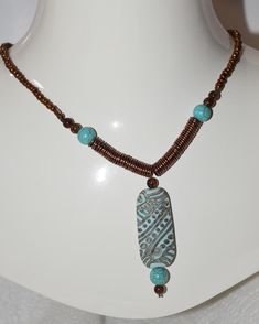 Turquois clay bead accented by copper and howlite beads Artisan Brown Turquoise Necklace For Jewelry Making, Earthy Turquoise Jewelry With Wooden Beads, Artisan Brown Turquoise Necklace With Gemstone Beads, Turquoise Beaded Copper Jewelry, Artisan Beaded Brown Turquoise Necklace, Artisan Turquoise Necklace With Wooden Beads, Artisan Brown Beaded Turquoise Necklace, Earthy Turquoise Beaded Necklaces, Clay Bead Necklace