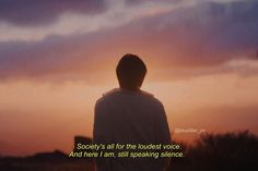 a person standing in front of a sunset with the words society's all for the loud voice and here i am, speaking