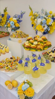 a table topped with lots of different types of food and drinks on top of it