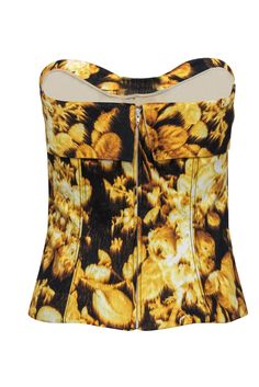 Rock some fab flower power with this darling top from Carolina Herrera! Made in a sultry bustier style with a bright and bold floral print and adorable bow, this statement piece is perfect for all your warm weather excursions. Whether you're headed downtown for brunch or mingling at a backyard soiree, pair this beauty with a flare skirt and woven wedges and you'll be looking classically chic! Size 4 Shell: 97% Cotton, 3% Spandex Lining: 100% Silk Made in USA Concealed back zipper Lined Bustier-s Chic Strapless Floral Print Top, Chic Strapless Top With Floral Print, Floral Print Bandeau Top For Party, Strapless Tops With Corset Back For Spring, Strapless Spring Tops With Corset Back, Trendy Summer Tops With Boned Bodice, Spring Trendy Tops With Boned Bodice, Trendy Spring Tops With Boned Bodice, Floral Print Fitted Corset For Party