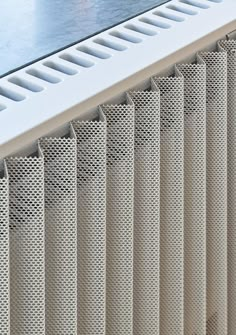 a close up view of a radiator and the side panel with holes in it