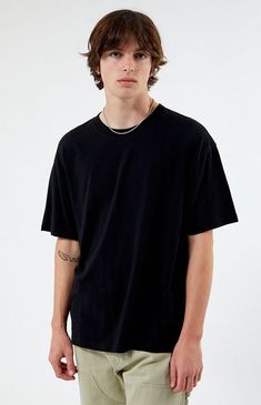 The Basic Oversized Boxy T-Shirt from PS Basics has major chill vibes. This everyday tee has a comfortable oversized fit with short sleeves, a crew neckline, and a boxy fit.   	Solid color tee 	Short sleeves 	Crew neckline 	Boxy oversized fit 	100% Cotton 	Machine washable 	Model is wearing a size medium Depop Outfit, Boxy Tshirt, Black Tshirt Men, Oversized Crop Top, Basic Wardrobe, Outfits Hombre, Oversized Outfit, Chill Vibes, Blank T Shirts