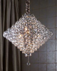 a crystal chandelier hanging from the ceiling