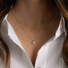 This timeless necklace is the perfect addition to elevate any look. Featuring a beautiful emerald cut diamond, this necklace will add the perfect amount of elegance to any outfit. Can be worn alone or paired with other pieces for a gorgeous stacked look! Made of 925 Sterling Silver THICK plating of 14k Gold or Rhodium Chain Length - 16” or 18" + 3” Extension Made of HIGHEST QUALITY Cubic Zirconia VERY HIGH QUALITY Nickel-free & Hypoallergenic - will not irritate skin! Lobster Clasp Closure Minimalist Necklace Stack, Emerald Cut Diamond Necklace, Dainty Necklace Stack, Gold Asthetics, Emerald Cut Necklace, Baguette Pendant, Dainty Necklace Gold, Timeless Necklace, Dainty Jewellery