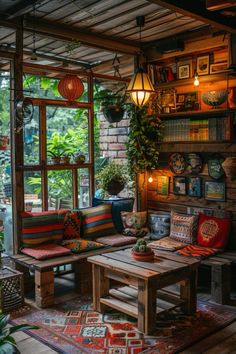 a living room filled with lots of furniture and plants