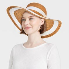 Update your summer accessories with this Striped Straw Floppy Hat from Shade & Shore™. This woven floppy hat features a striped pattern for a chic, contrasting look. Made of midweight paper straw material, it provides a comfortable fit for all-day wear, and the pull-on style makes it easy to put on or take off. Plus, the 4.75-inch brim keeps your face shaded from the sun's rays. Shade & Shore™: Found exclusively at Target. White Lightweight Vacation Hat, White Lightweight Hat For Vacation, White Straw Sun Hat For Vacation, White Straw Hat For Sunbathing On Vacation, White Straw Hat For Sunbathing And Vacation, White Straw Hat With Upf 50+ For Sunbathing, White Wide Brim Panama Hat For Spring, Trendy White Sun Hat For Vacation, White Straw Hat Upf 50+ For Sunbathing