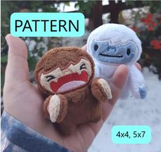 a hand holding two small stuffed animals in it's palm, with the caption pattern below