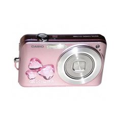 a pink digital camera sitting on top of a white surface