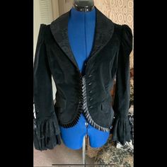 In Super Excellent New Condition, Collectible Discontinued Gorgeous Elegant Goth Cotton Velvet Jacket Has Corset Back, Dripping With Lace And Old Victorian Style Pleated Satin Trim, Buttons Look Like Antique Jet. A Rare Item. Arm Pit To Arm Pit 19” Waist 34” Or Less Back Length To Fabric Hem 22” Center Back To Bell Cuff 34” Discontinued Rare Item. Princess Jacket, Elegant Goth, Goth Princess, Corset Back, Velvet Jacket, Cotton Velvet, Victorian Style, Jacket Coat, Victorian Fashion