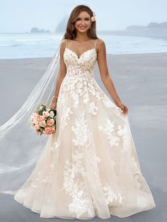 a woman in a wedding dress on the beach