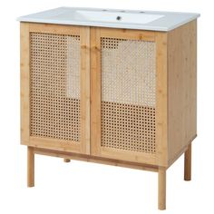 a wooden cabinet with a white sink on it's front and side panels in the back