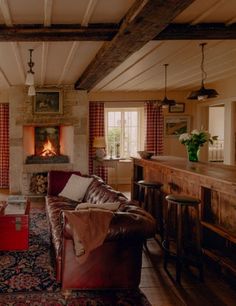 a living room filled with furniture and a fire place