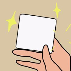 a person's hand holding a white card with yellow stars on the back ground