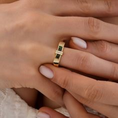 Indulge in the timeless elegance of our 14K gold rings, meticulously crafted to enhance your personal style. Each ring is expertly made from genuine 14K gold, radiating a warm and luxurious glow that will captivate all who lay eyes on it. Our collection boasts an array of stunning designs, ranging from sleek and minimalist to intricate and ornate, ensuring there's a perfect ring to match your unique taste. Whether you're looking for a statement piece to dazzle at special occasions or a delicate Modern Baguette Cut Birthstone Promise Ring, 14k Gold Rings With Baguette Diamonds, Fine Jewelry Baguette Cut Birthstone Promise Ring, Fine Jewelry Promise Birthstone Ring In Baguette Cut, Elegant Gold Emerald Ring With Baguette Diamonds, Classic Gold Emerald Ring With Baguette Diamonds, Luxury Emerald Ring In Yellow Gold With Baguette Diamonds, Elegant Baguette Cut Birthstone Promise Ring, Luxury Yellow Gold Emerald Ring With Baguette Diamonds