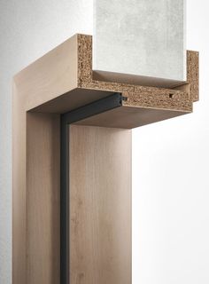 a wooden shelf with a mirror on top of it