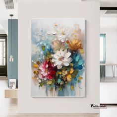 a painting on the wall with flowers in it