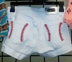 a pair of shorts with baseball stitching on them