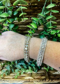 Add a dash of sparkle to your ensemble with the Rhinestone Wire Bangle Bracelet Set. This dazzling trio of bangles, available in both gold and silver tones, is designed to capture the light and the attention in any room. Each 65mm bracelet is embellished with stunning rhinestones, offering a radiant shine that complements any outfit, whether casual or formal. Key Features: Two Tone Options: Choose from elegant gold or sleek silver to best match your wardrobe and personal style. Sparkling Rhinest Diamond Accented Bangle Tennis Bracelet For Party, Glamorous Crystal Bangle With Rhinestones, Party Tennis Bracelet With Diamond Accents, Party Tennis Bangle Bracelet With Diamond Accents, Glamorous Adjustable Sparkling Bracelets, Glamorous Rhinestone Bangle Bracelets, Adjustable Bling Bangle Bracelet, Glamorous Bling Crystal Bangle Bracelet, Party Diamond Bangle Bracelet With Rhinestones