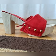 Unworn Wood And Suede Heeled Sandals/Mules/Clogs. Red Suede With Gold Rivets And Fringe Details. Casual Red High Heel Sandals, Red Beach Clogs With Round Toe, Red Block Heel Sandals For Beach, Casual Red Sandals With Stacked Heel, Casual Round Toe Clogs For Party, Casual Slip-on Clogs For Party, Casual Slip-on Party Clogs, Casual Party Slip-on Clogs, Red Clogs With Wooden Heel For Summer