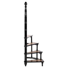 a set of three black and wood shelves with wooden treads on each shelf,