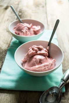 two bowls filled with ice cream on top of a table