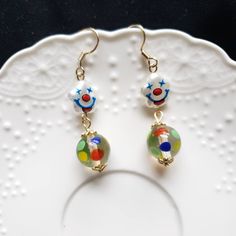 "Clown earrings acrylic clown beads , glass dot ball beads, gold plated hooks length: about 2\" Contains small parts. Use caution when giving to young children less than Age 3 Please keep them away from moisture. If you have any questions, please feel free to contact me. Thanks :)" Playful Gold Dangle Earrings, Playful Gold Earrings, Clown Core Accessories, Circus Jewelry, Clown Jewelry, Clowncore Earrings, Clown Necklace, Wierdcore Earrings, Indie Jewelry