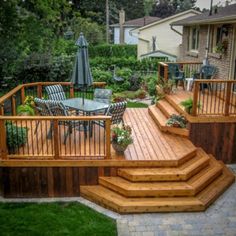 a wooden deck with steps leading up to it