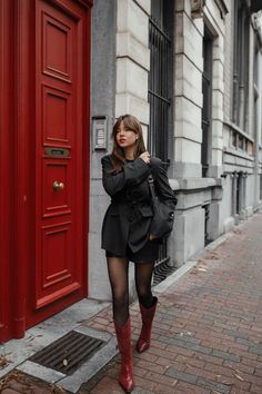 A woman wearing a black coat on a black dress with red cowboy boots Cowgirl Boots Outfit Winter, Casual Brunch Outfit Winter, Cowboy Boots Outfit Fall, Fall Outfits Baddie, Brown Cowboy Boots Outfit, Red Boots Outfit, Red Cowgirl Boots, Cowboy Boot Outfits, It Shoes