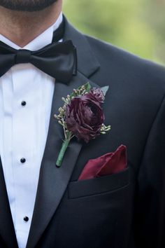 a man in a tuxedo with a boutonniere on his lapel