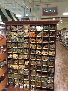 the shelves are full of spices and other items for sale in the store's aisles