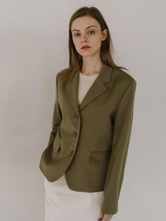 This jacket showcases a blazer with a notched lapel, contributing to a refined and professional silhouette. It is styled with a two-button front closure which is standard for a classic blazer design. The tailored garment includes patch pockets, adding a touch of casual functionality. Its fabric appears smooth and likely has a fine weave, indicating a quality construction.- The blazer features a structured shoulder, enhancing the garment's tailored form.- The sleeves terminate at the wrist, with no visible buttons or embellishments on the cuffs.- This piece, with its timeless design, could be versatile in both formal and semi-formal settings. Classic Button-up Blazer For Work, Classic Notched Blazer For Spring, Classic Single Breasted Blazer For Spring, Classic Single-breasted Spring Blazer, Classic Spring Single-breasted Blazer, Timeless Button-up Blazer With Hidden Closure, Timeless Single Breasted Button-up Blazer, Classic Sport Coat With Hidden Button Closure For Office, Timeless Single-breasted Button-up Blazer