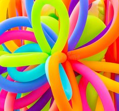 an abstract photograph of colorful balloons in the shape of a ballon - like object