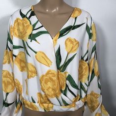 Ashley Stewart Blouse V-Neck Cold Shoulder Cropped Tulip Print Tie Cuffs 12 New. Side Zip Closure. 100% Polyester Chest Measured Pit To Pit: 20" Length Measured Shoulder To Hem: 20" Sleeve Measured Pit To Cuff: 20" Side Measured Pit To Bottom Hem: 10" Thank You For Choosing A More Sustainable Way To Shop. Please Note That We Do Our Best To Find Any Flaws And We Try To Give The Most Accurate Description Possible. We Want Our Shoppers To Have An All Around Great Experience When Visiting Our Store. Trendy V-neck Top With Blouson Sleeves, Spring Long Sleeve V-neck Top For Brunch, Chic Long Sleeve V-neck Top For Spring, Fitted V-neck Top For Spring, V-neck Tops With Blouson Sleeves For Day Out, White Long Sleeve V-neck Top For Spring, Summer V-neck Top With Blouson Sleeves, Yellow V-neck Blouse For Spring, Yellow V-neck Blouse For Brunch