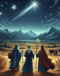 three wise men are looking at the stars in the sky above them, and one is holding a staff