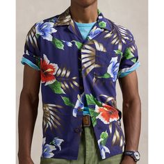 This shirt is a part of a special collaboration between Polo Ralph Lauren and Hoffman Fabrics. The original pattern was sourced from the personal archive of Mr. Walter Hoffman whose iconic tropical-print textiles have been a staple of modern surfwear since the 1950s. It was then updated specifically for us to make it distinctly Polo. Tropical Tops With Camp Collar And All Over Print, Tropical Printed Shirt With Camp Collar, Multicolor Camp Shirt With Hibiscus Print And Camp Collar, Vintage Print Camp Collar Top For Vacation, Ralph Lauren Casual Summer Shirt, Blue Camp Shirt With All Over Print, Vacation Tops With Vintage Print And Camp Collar, Hawaiian Camp Shirt With Vintage Print, Tropical Printed Camp Shirt With Camp Collar